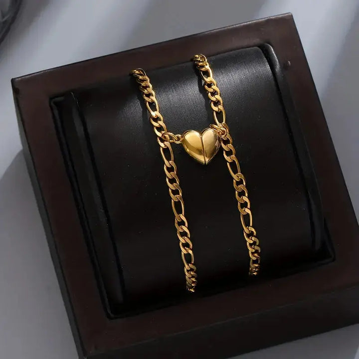 Magnet Love Bracelets by CouplesChoices.com—gold matching couple bracelets with heart-shaped magnetic charms that connect when together, symbolizing attraction and unity.