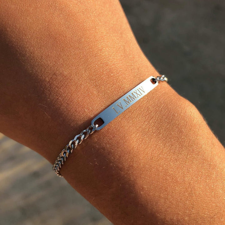 Matching engraved couple bracelets with minimalist chain link design in silver, gold, and black finishes, featuring personalized nameplate tags—romantic gift for couples by CouplesChoices.com.