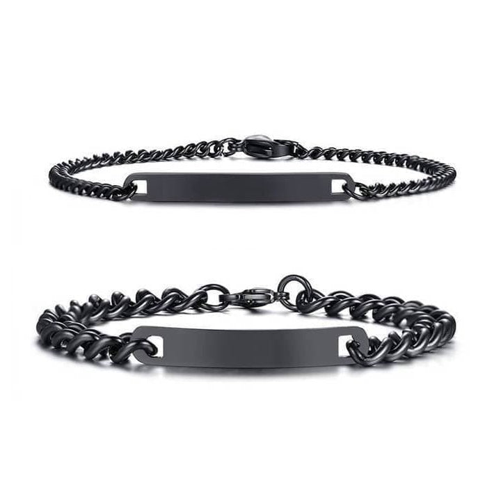 Matching engraved couple bracelets with minimalist chain link design in silver, gold, and black finishes, featuring personalized nameplate tags—romantic gift for couples by CouplesChoices.com.