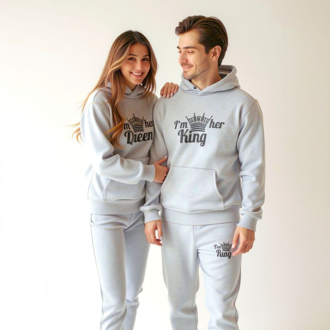 Matching gray King and Queen tracksuits for couples from CouplesChoices.com, featuring crown graphics and bold 'I'm her King' and 'I'm his Queen' prints on hoodies and joggers—crafted for comfort, unity, and standout street style.