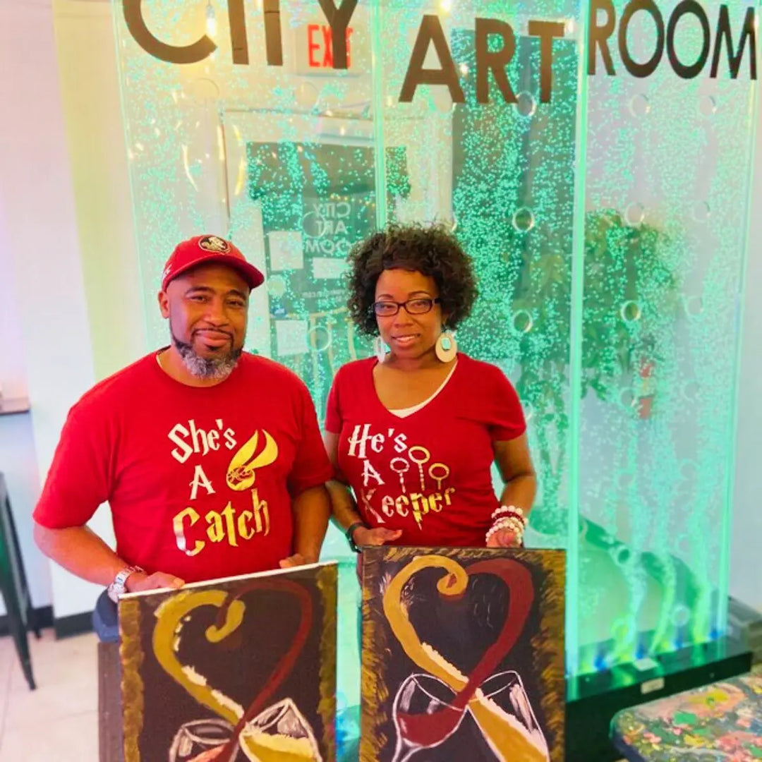 Matching maroon couple shirts with gold foil text: 'She’s a Catch' featuring a golden snitch, and 'He’s a Keeper' with Quidditch goalposts – perfect for Potterhead pairs.