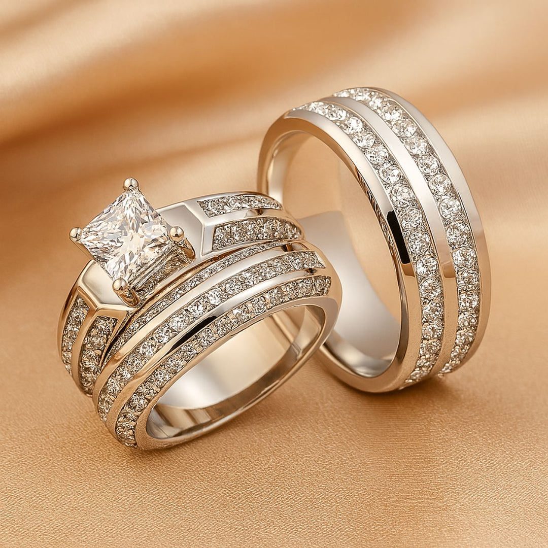 Miracle Ring Set by CouplesChoices.com showcasing a princess-cut center stone on a pavé-set engagement ring, paired with a matching eternity band and a coordinating dual-row men’s band in polished white gold—crafted for timeless brilliance.