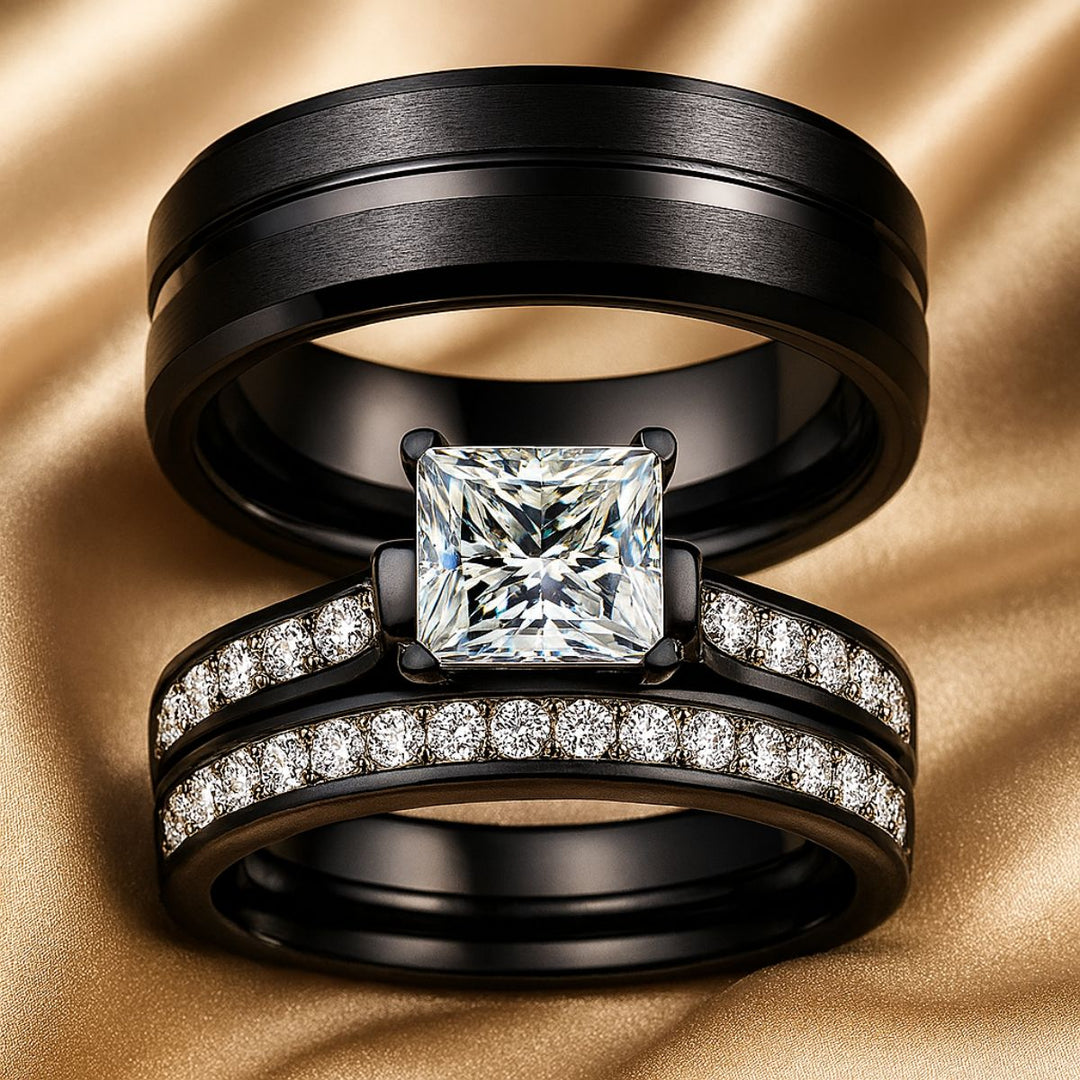 Moonlight Shadow Rings by CouplesChoices.com, featuring a black metal bridal set with a princess-cut center stone and pavé diamond bands, paired with a sleek black tungsten men’s ring.