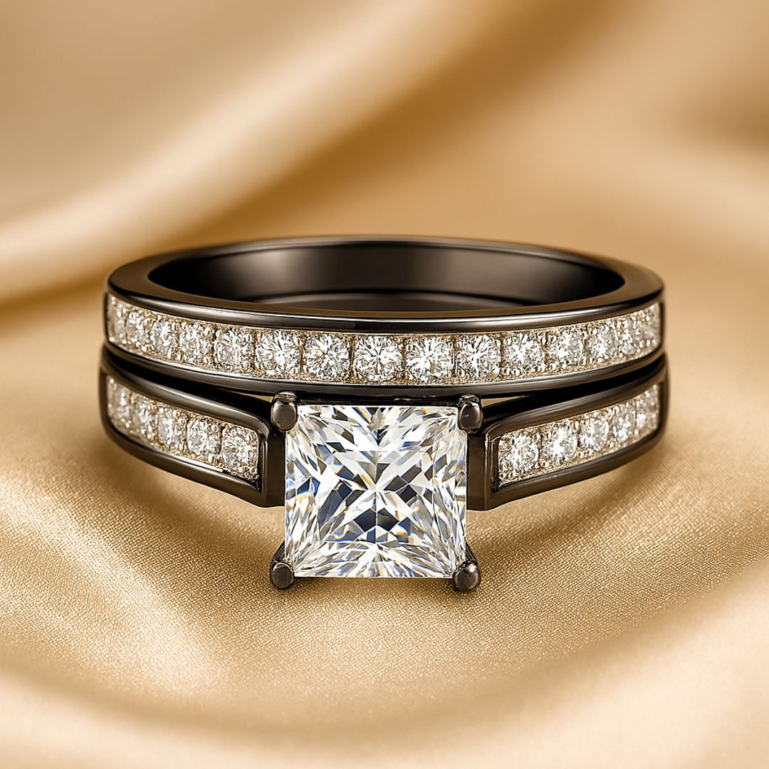 Moonlight Shadow Rings by CouplesChoices.com, featuring a black metal bridal set with a princess-cut center stone and pavé diamond bands, paired with a sleek black tungsten men’s ring.