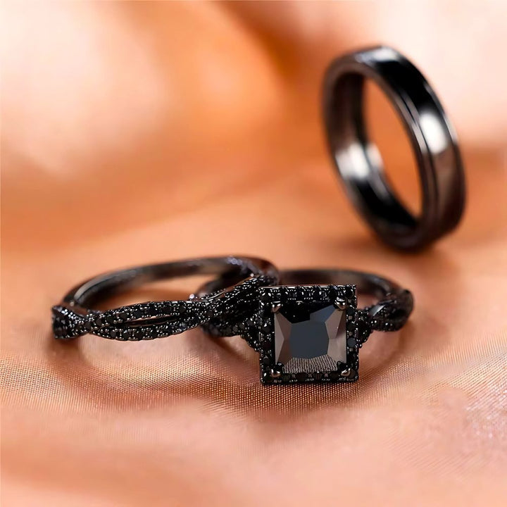 Noir Rings by CouplesChoices.com, featuring a bold black princess-cut engagement ring with pavé black gemstone detailing and matching black tungsten bands—designed to embody elegance, power, and modern romance.