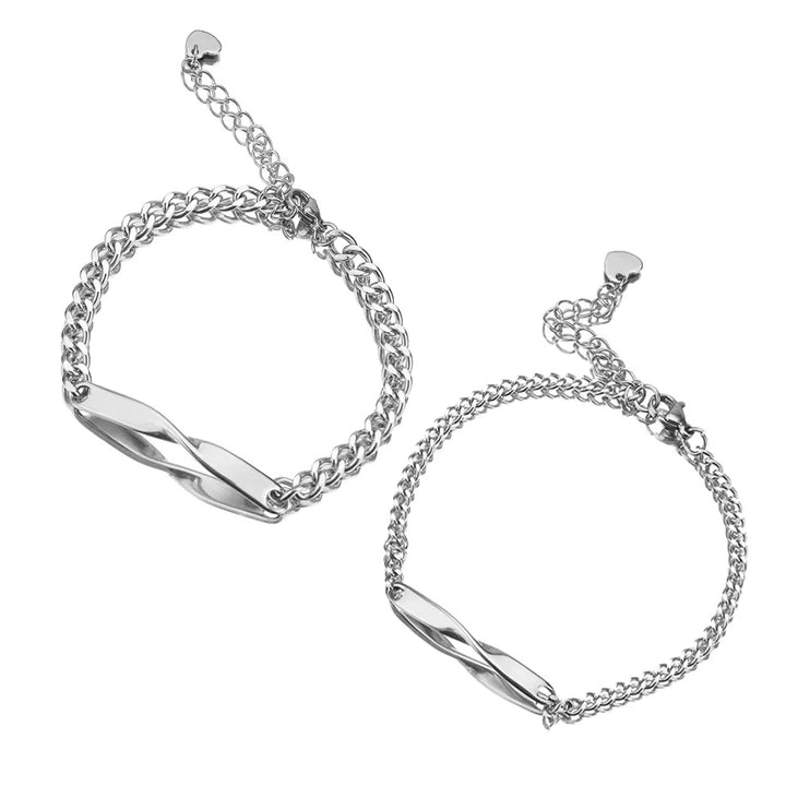 Personalized couples bracelets with twisted engraved nameplates and adjustable chain links, available in silver, gold, and rose gold—romantic matching gift from CouplesChoices.com.