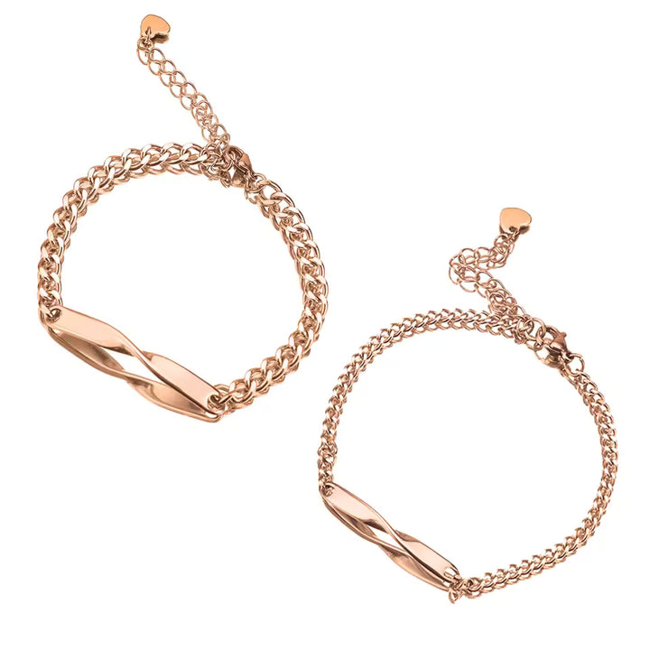 Personalized couples bracelets with twisted engraved nameplates and adjustable chain links, available in silver, gold, and rose gold—romantic matching gift from CouplesChoices.com.