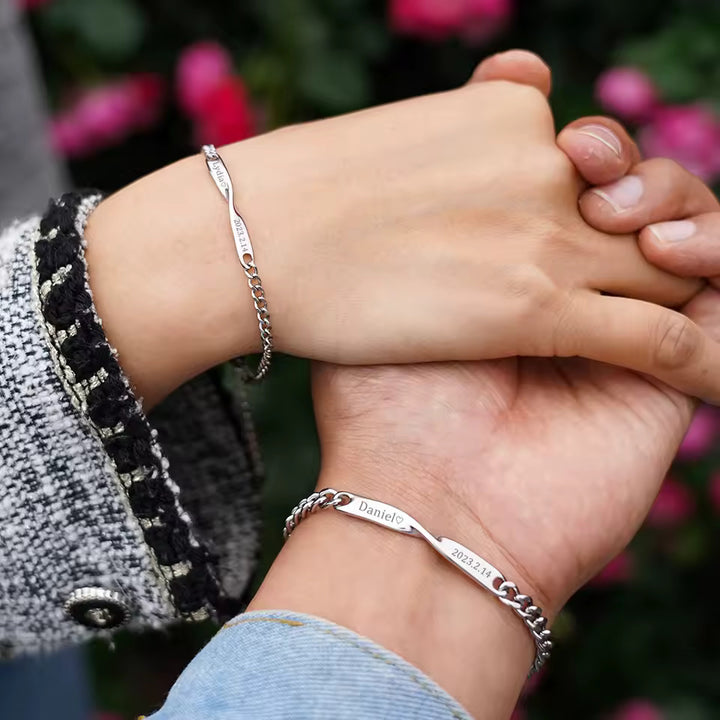 Personalized couples bracelets with twisted engraved nameplates and adjustable chain links, available in silver, gold, and rose gold—romantic matching gift from CouplesChoices.com.