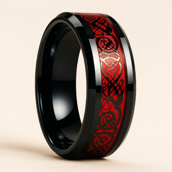 Red Beauty ring set from CouplesChoices.com, featuring a bold black engagement ring with red round-cut center stone and pavé red side stones, paired with a matching eternity band and a black tungsten men’s ring with engraved red Celtic inlay.