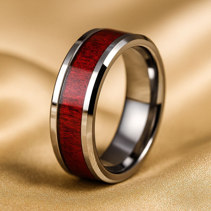 Red Love ring set by CouplesChoices.com, featuring a heart-shaped diamond atop vintage pavé bands with ruby red and white stones, paired with a polished redwood inlay band for timeless romance.