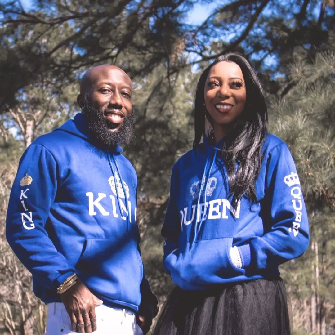 Royal blue matching couple hoodies from CouplesChoices.com featuring bold white “KING” and “QUEEN” lettering with crown graphics on the chest, sleeves, and hood. A stylish, statement-making set for couples who reign in love and unity.