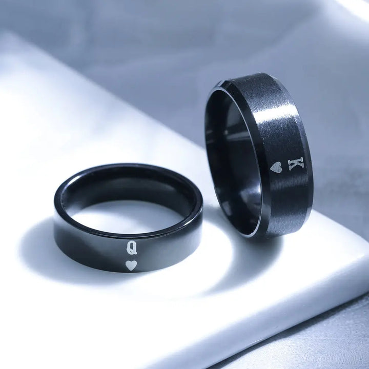 Sleek black Obsession Rings by CouplesChoices.com featuring engraved King and Queen of Hearts symbols—perfectly paired for modern lovers who rule each other’s world.