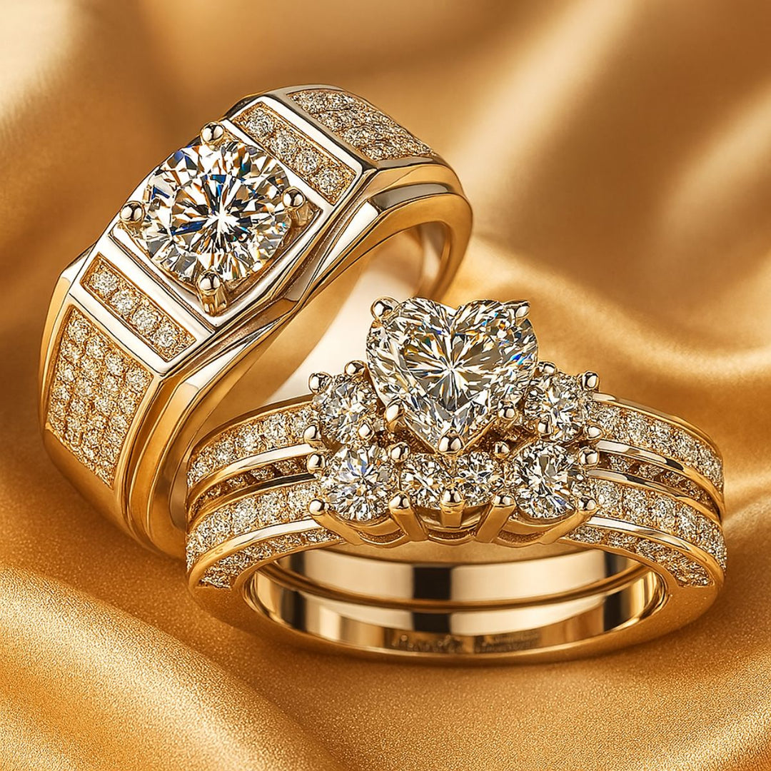 Spring Heart wedding ring set from CouplesChoices.com, featuring a heart-shaped center stone with pavé diamonds on a triple-row band, paired with a men’s ring with a round-cut center and pavé-set accents in platinum finish.