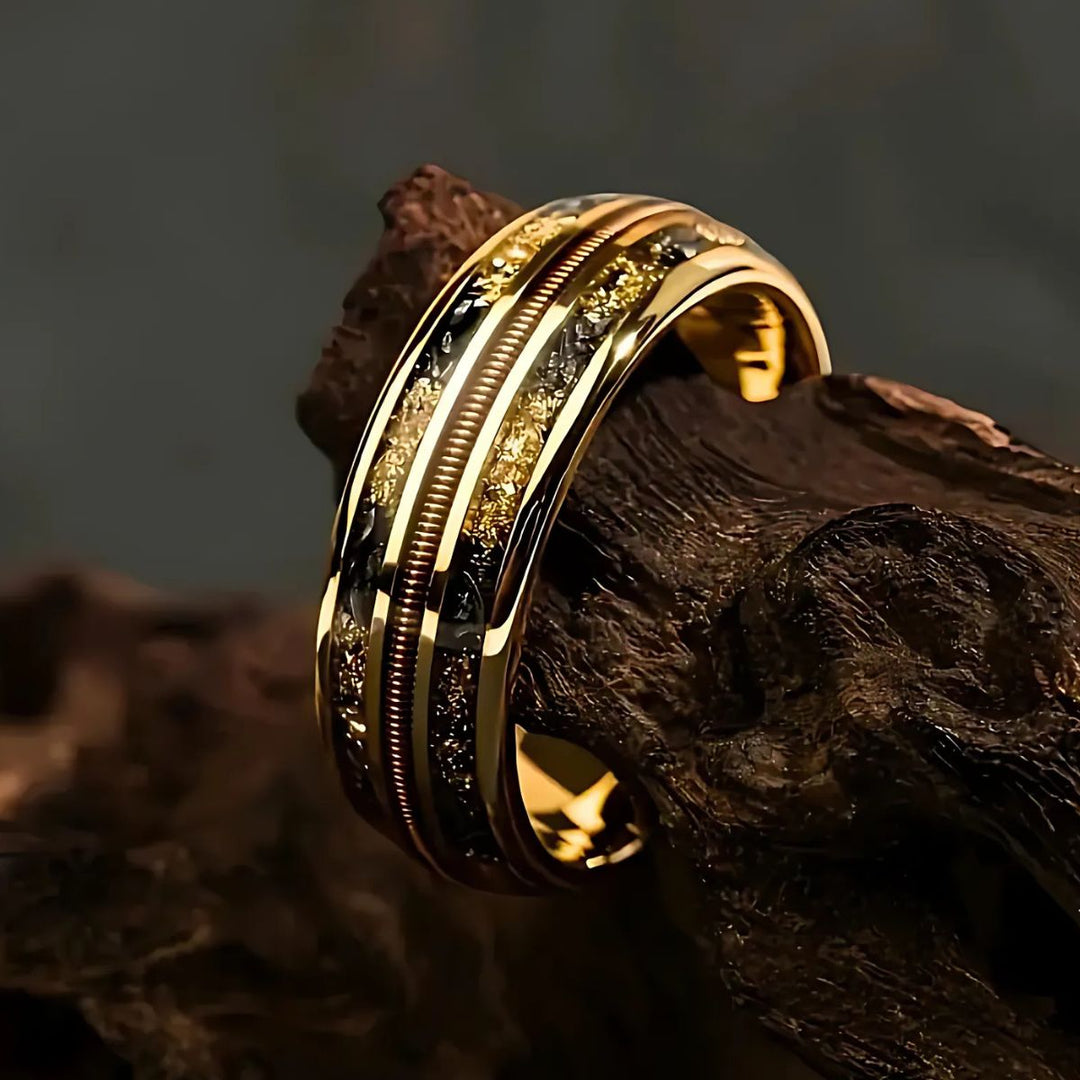 Starforged gold couple rings by CouplesChoices.com, featuring black and gold meteorite inlays and a central textured copper band—symbolizing strength, unity, and timeless elegance.
