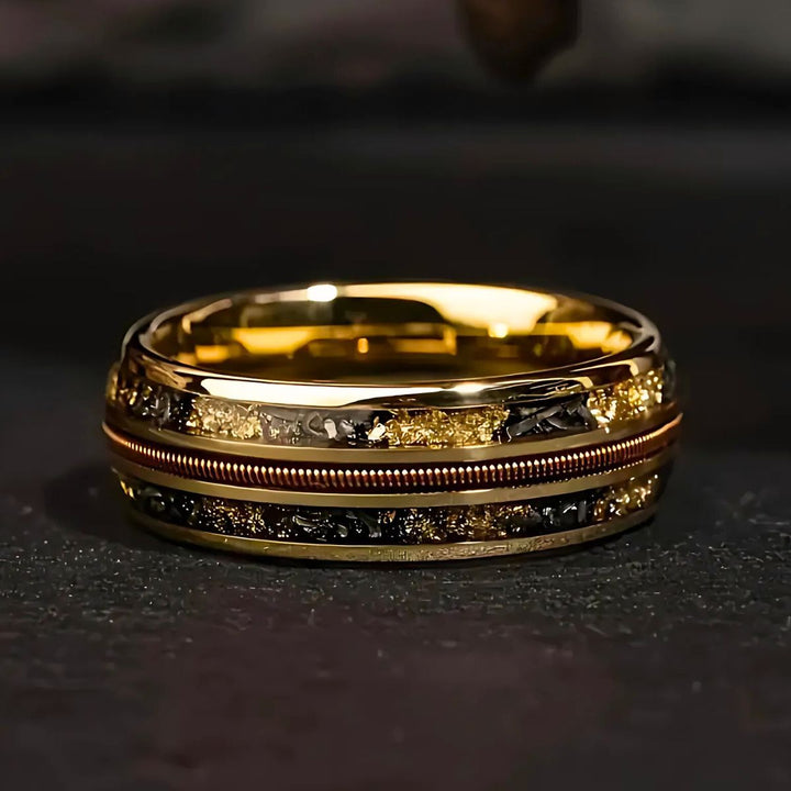 Starforged gold couple rings by CouplesChoices.com, featuring black and gold meteorite inlays and a central textured copper band—symbolizing strength, unity, and timeless elegance.