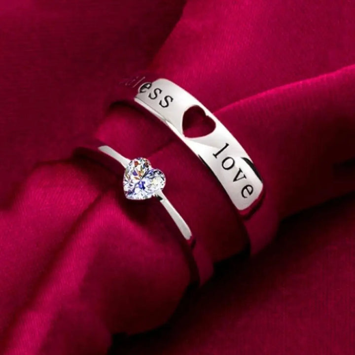 The Endless Love Rings from CouplesChoices.com feature elegant silver bands engraved with “endless love,” crowned by a heart-cut stone—perfectly symbolizing a forever bond built on devotion, simplicity, and timeless romance.