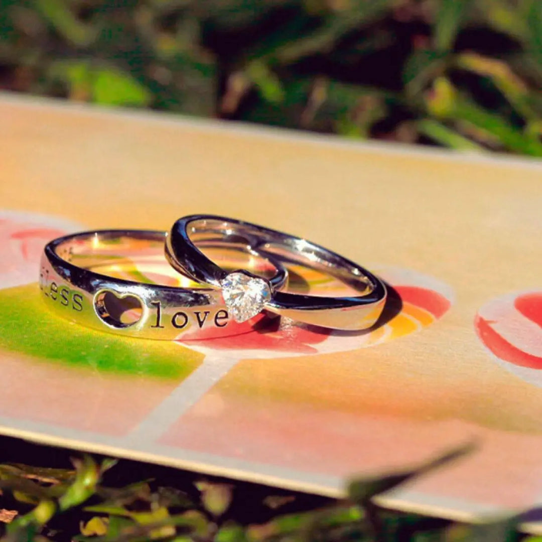 The Endless Love Rings from CouplesChoices.com feature elegant silver bands engraved with “endless love,” crowned by a heart-cut stone—perfectly symbolizing a forever bond built on devotion, simplicity, and timeless romance.
