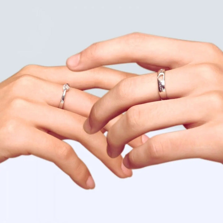 The Endless Love Rings from CouplesChoices.com feature elegant silver bands engraved with “endless love,” crowned by a heart-cut stone—perfectly symbolizing a forever bond built on devotion, simplicity, and timeless romance.