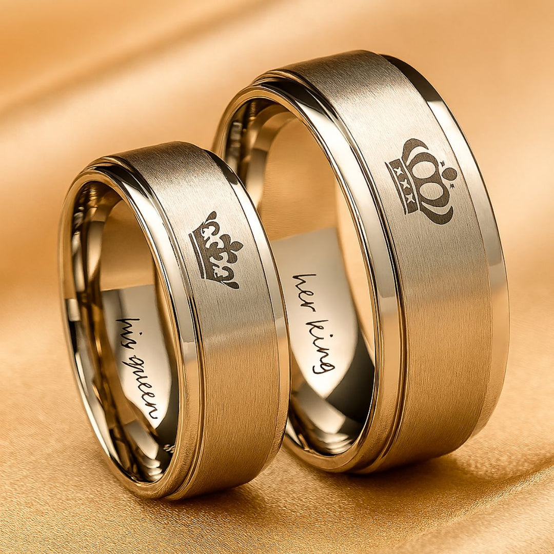 Timeless Exhilaration Rings by CouplesChoices.com—brushed silver bands engraved with elegant crown icons and inner "Her King" & "His Queen" inscriptions. A sleek, modern symbol of eternal love, loyalty, and royalty-inspired devotion.