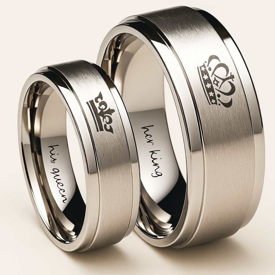 Timeless Exhilaration Rings by CouplesChoices.com—brushed silver bands engraved with elegant crown icons and inner "Her King" & "His Queen" inscriptions. A sleek, modern symbol of eternal love, loyalty, and royalty-inspired devotion.