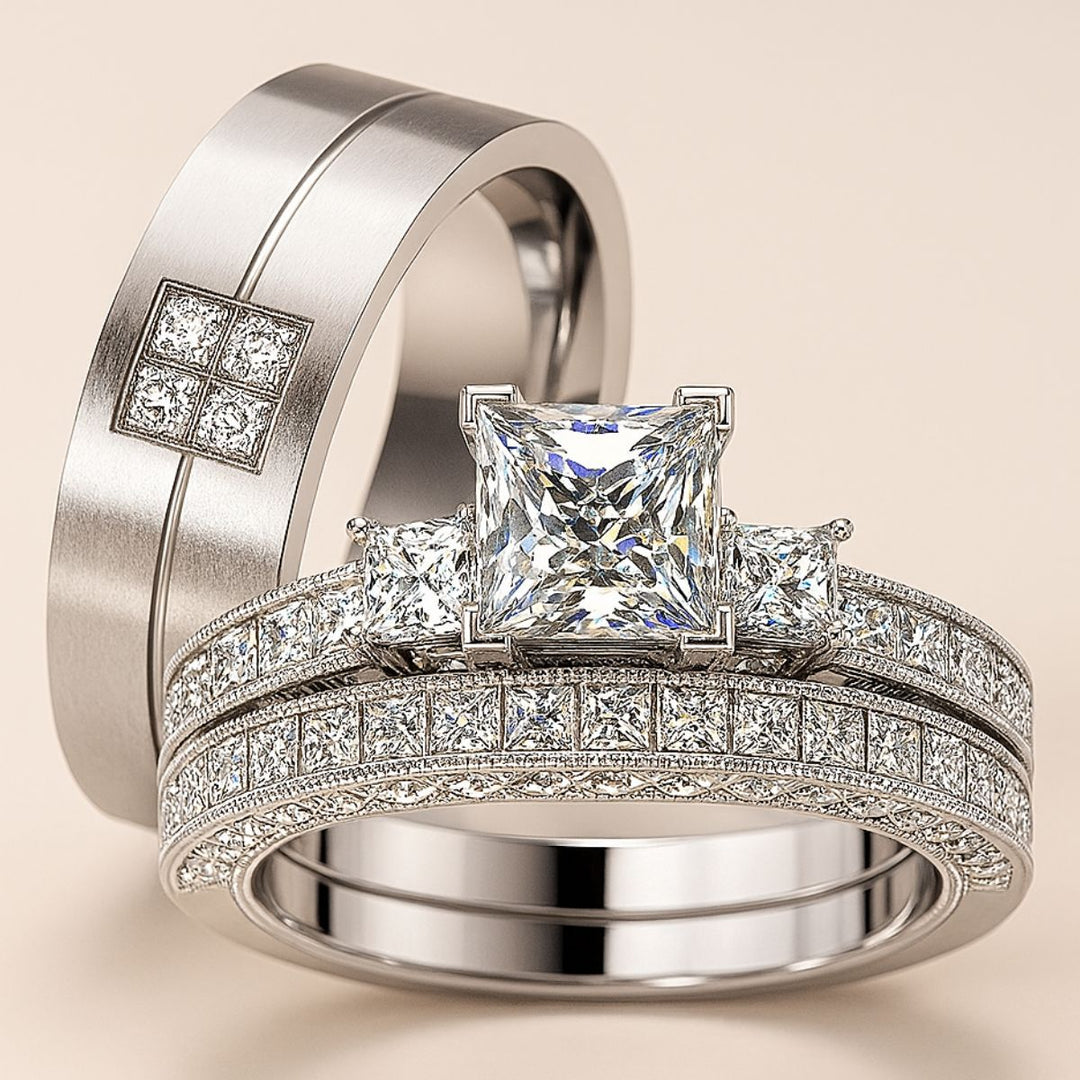 Timelessly elegant Honey Moon Rings by CouplesChoices.com, featuring a princess-cut centerpiece flanked by dazzling side stones, perfectly paired with a sleek men’s band adorned with a square cluster of pavé diamonds.