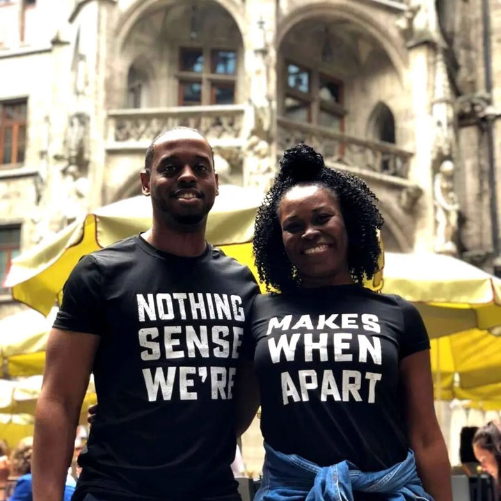 Couple wearing matching black shirts that read 'Nothing Makes Sense We’re' and 'Makes When Apart'—a playful and heartfelt message when worn together. Perfect for couples who want to show love and humor. From CouplesChoices.com.