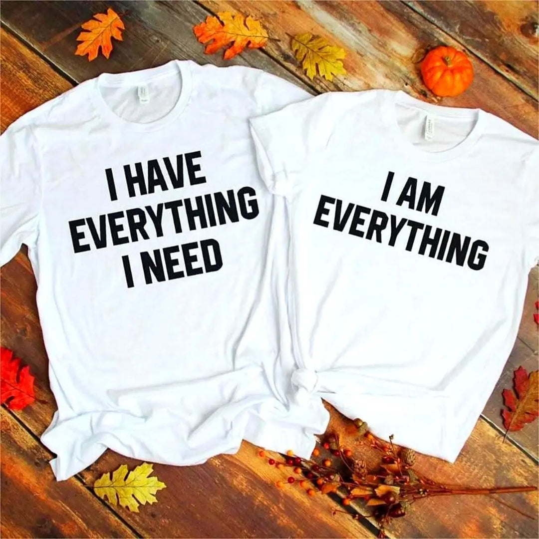 Couples matching white T-shirts from CouplesChoices.com—his says “I Have Everything I Need,” hers says “I Am Everything”—a bold, stylish way to express love, unity, and connection.