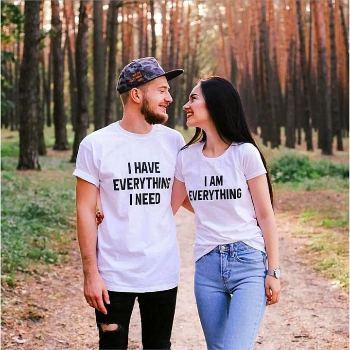 Couples matching white T-shirts from CouplesChoices.com—his says “I Have Everything I Need,” hers says “I Am Everything”—a bold, stylish way to express love, unity, and connection.