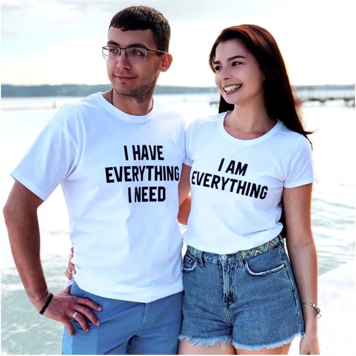 Couples matching white T-shirts from CouplesChoices.com—his says “I Have Everything I Need,” hers says “I Am Everything”—a bold, stylish way to express love, unity, and connection.