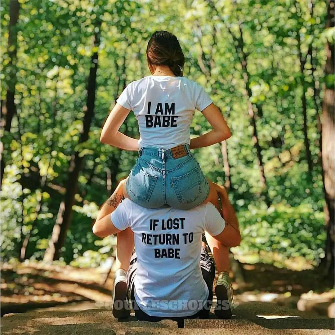 Couples matching white T-shirts from CouplesChoices.com—his says “If Lost Return to Babe,” hers says “I Am Babe.” A fun, romantic way to express loyalty, love, and playful devotion in a relationship.