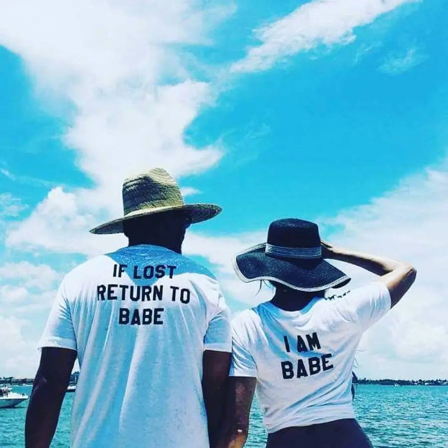 Couples matching white T-shirts from CouplesChoices.com—his says “If Lost Return to Babe,” hers says “I Am Babe.” A fun, romantic way to express loyalty, love, and playful devotion in a relationship.