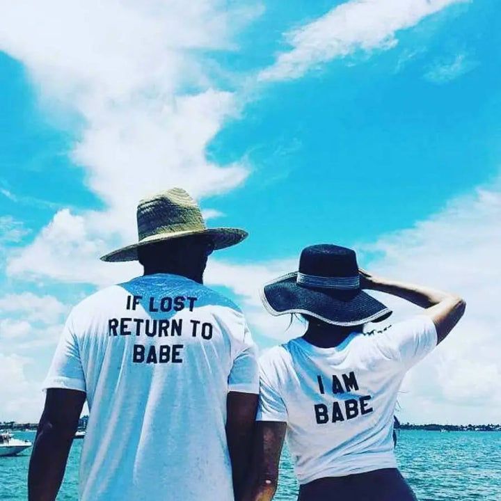 Couples matching white T-shirts from CouplesChoices.com—his says “If Lost Return to Babe,” hers says “I Am Babe.” A fun, romantic way to express loyalty, love, and playful devotion in a relationship.