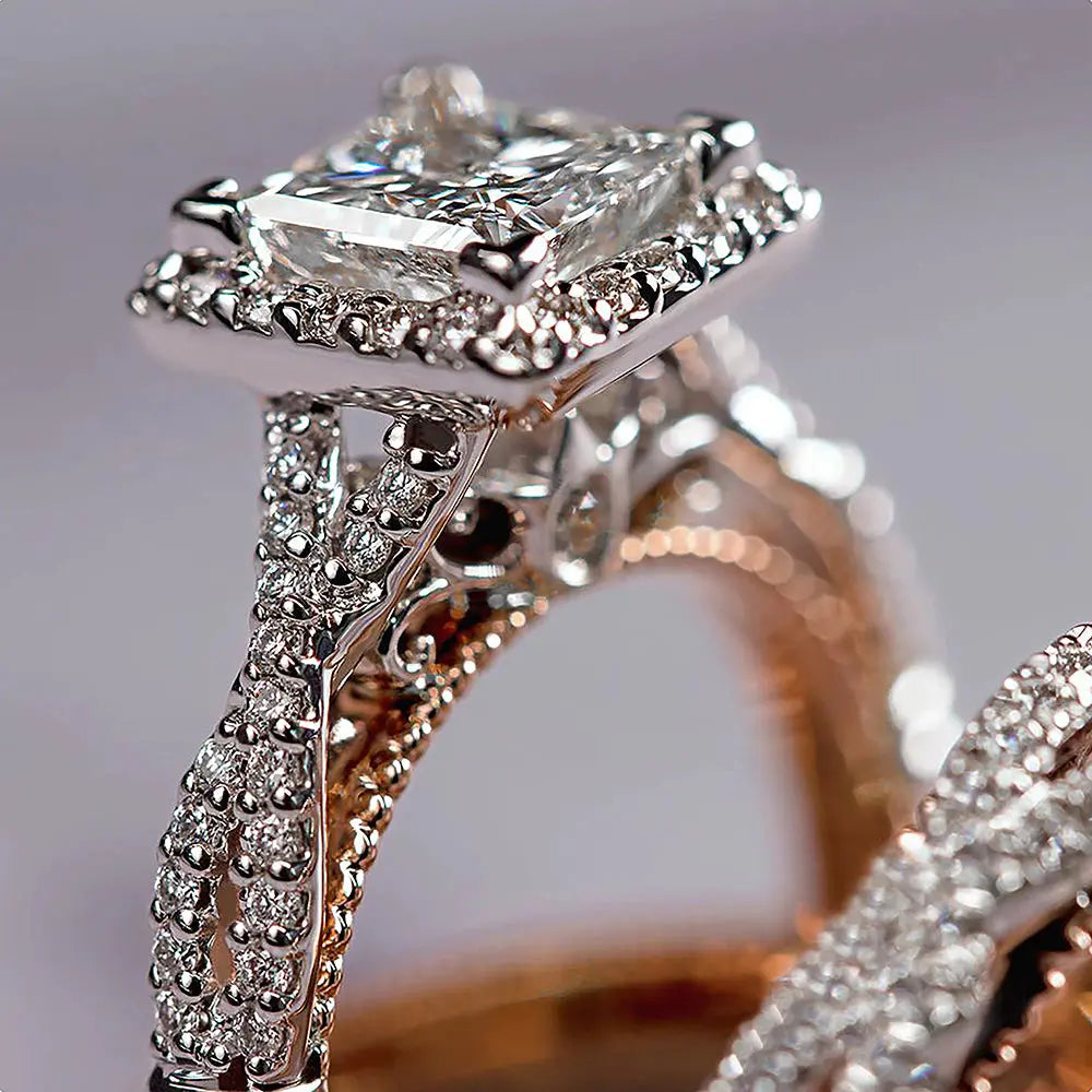 Del Mar ring set by CouplesChoices.com, featuring a princess-cut center diamond with pavé infinity band in rose gold, paired with a hammered silver-tone men’s band with rose gold edges.
