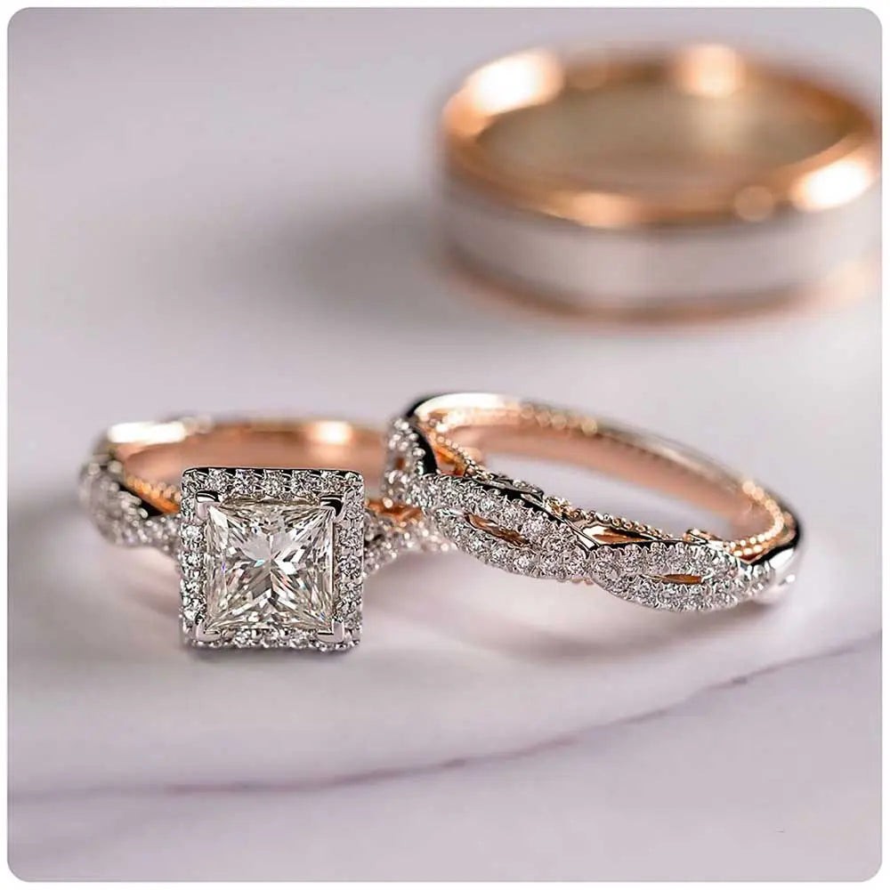 Del Mar ring set by CouplesChoices.com, featuring a princess-cut center diamond with pavé infinity band in rose gold, paired with a hammered silver-tone men’s band with rose gold edges.
