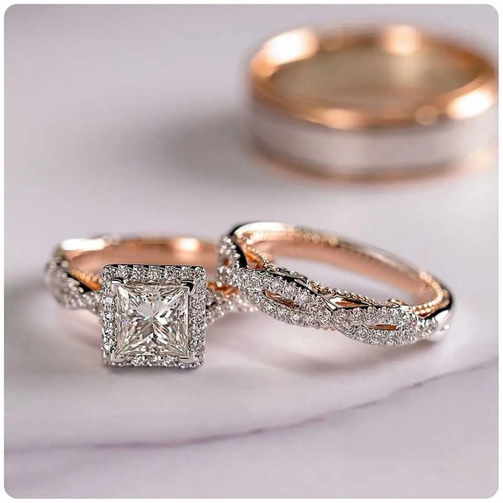 Del Mar ring set by CouplesChoices.com, featuring a princess-cut center diamond with pavé infinity band in rose gold, paired with a hammered silver-tone men’s band with rose gold edges.