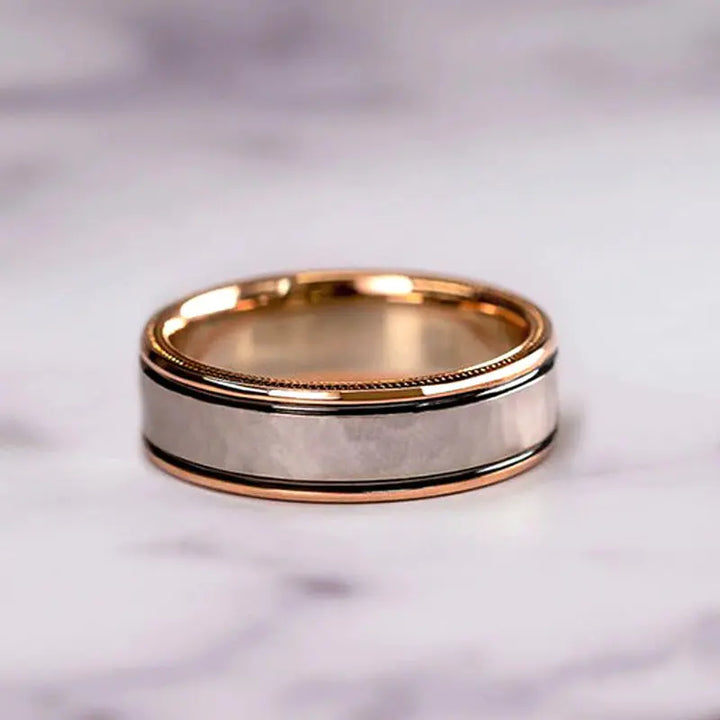 Del Mar ring set by CouplesChoices.com, featuring a princess-cut center diamond with pavé infinity band in rose gold, paired with a hammered silver-tone men’s band with rose gold edges.