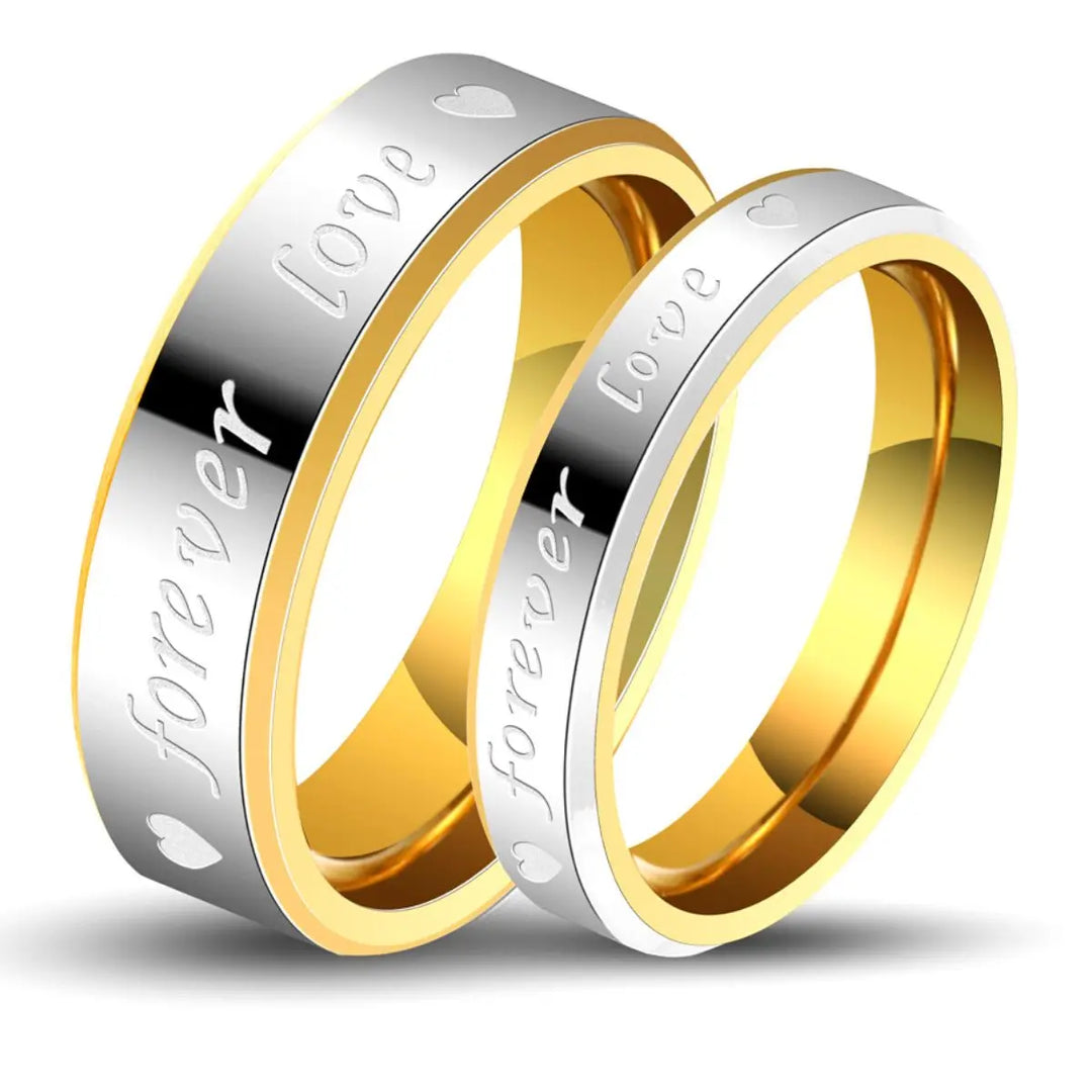 Elegant Forever Love Rings by CouplesChoices.com in radiant gold and silver tones, engraved with hearts and timeless words—crafted to symbolize eternal commitment and cherished connection.