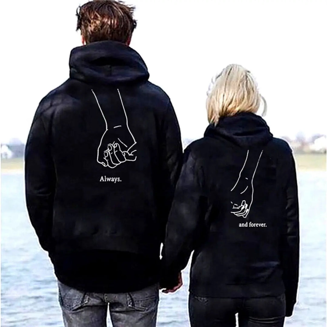 Matching "Always & Forever" couple hoodies in black from CouplesChoices.com, featuring minimalist white line art of intertwined pinkies and romantic typography — the perfect cozy statement for everlasting love and connection.