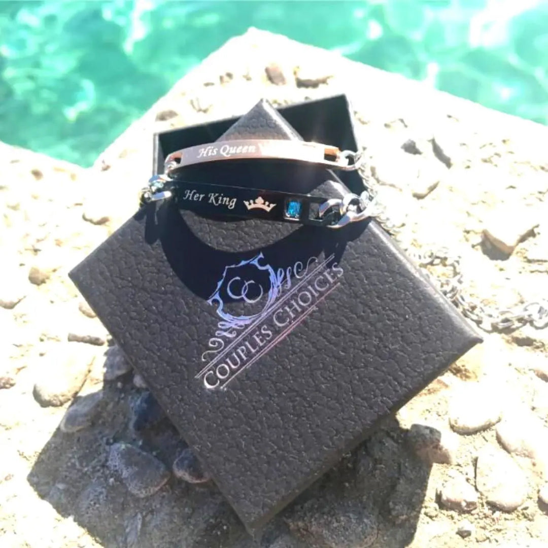 Matching ‘Her King’ and ‘His Queen’ engraved couple bracelets by CouplesChoices.com, featuring crown icons, crystal accents, and durable chain links—symbolizing loyalty, love, and royal connection.