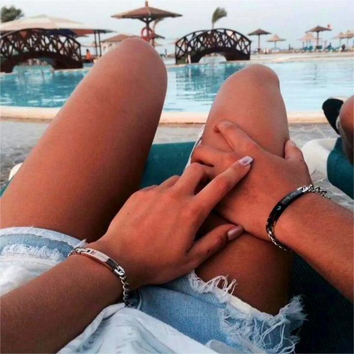 Matching ‘Her King’ and ‘His Queen’ engraved couple bracelets by CouplesChoices.com, featuring crown icons, crystal accents, and durable chain links—symbolizing loyalty, love, and royal connection.