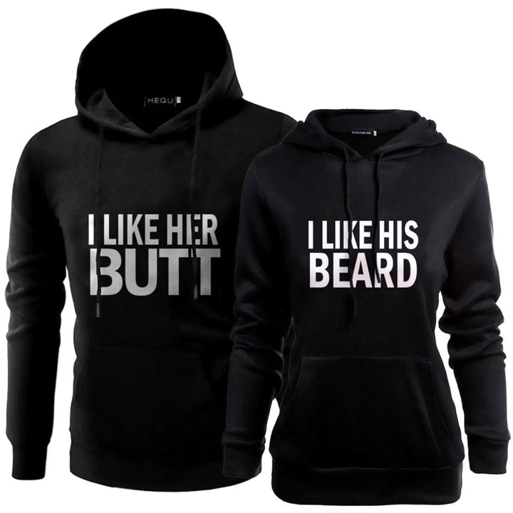 Matching black couple hoodies with bold white text — “I LIKE HER BUTT” on his and “I LIKE HIS BEARD” on hers — from CouplesChoices.com. Fun, flirty, and perfect for couples who love playful, stylish matching outfits.