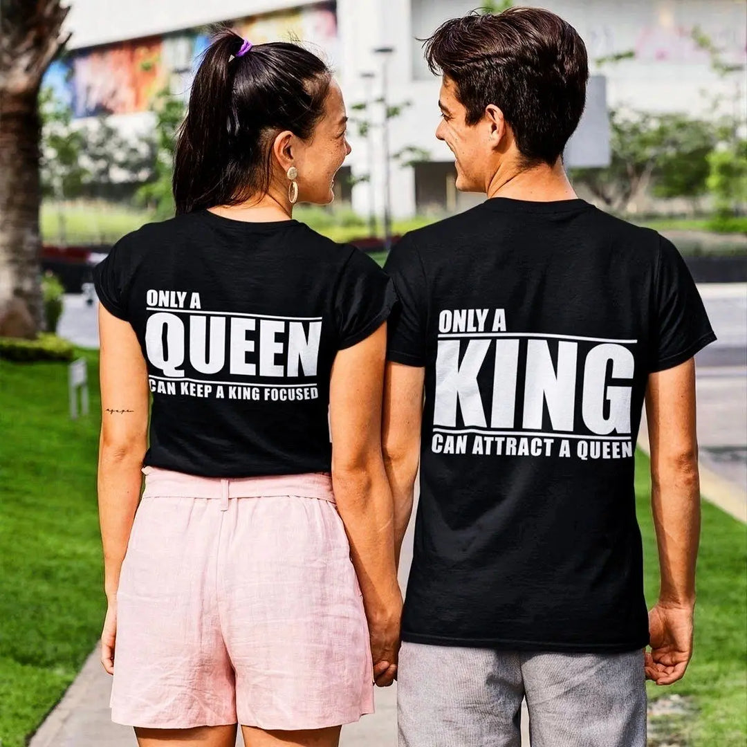 Matching black couple shirts—his says 'Only a King Can Attract a Queen,' hers reads 'Only a Queen Can Keep a King Focused.' A bold, empowering duo from CouplesChoices.com celebrating royalty in love.