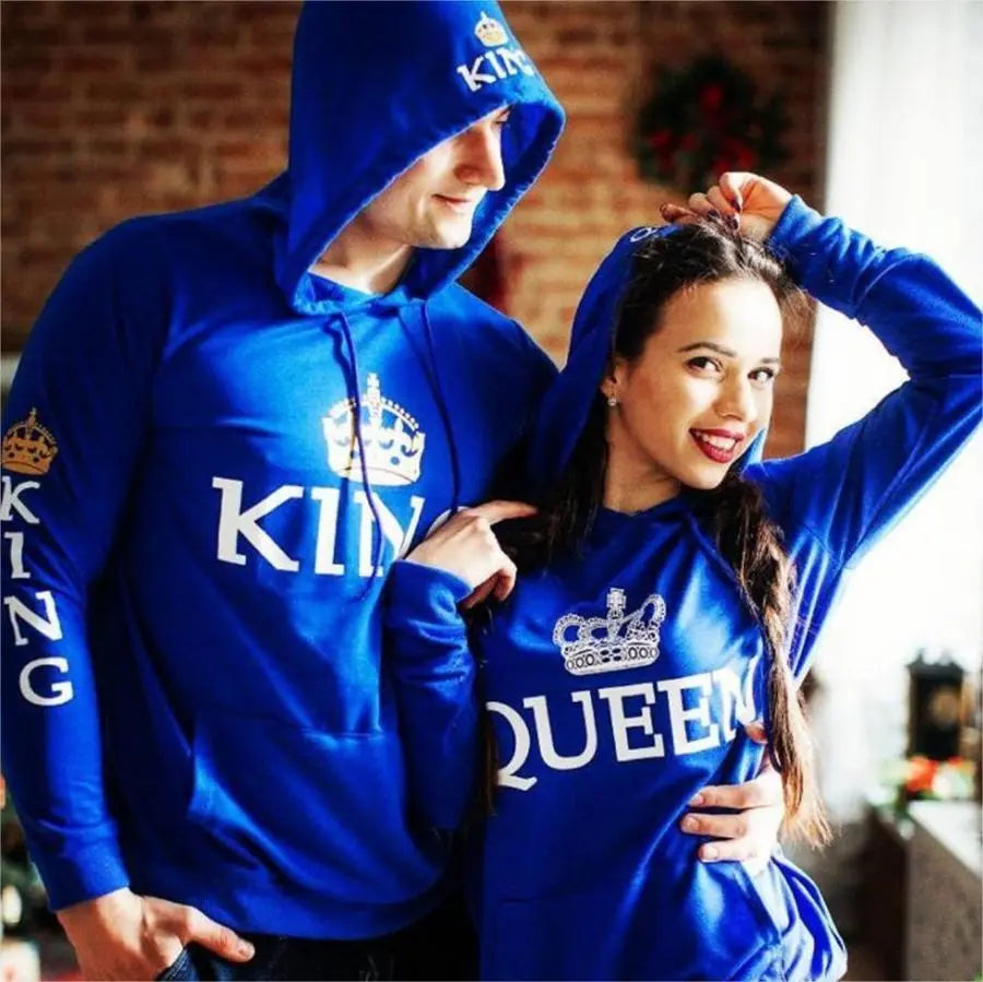 Royal blue matching couple hoodies from CouplesChoices.com featuring bold white “KING” and “QUEEN” lettering with crown graphics on the chest, sleeves, and hood. A stylish, statement-making set for couples who reign in love and unity.