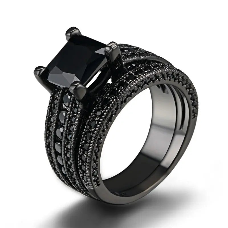 Sleek and bold, the Night Magic Rings from CouplesChoices.com feature a striking black princess-cut stone and matching band, designed for couples who dare to stand out with timeless elegance and powerful unity.